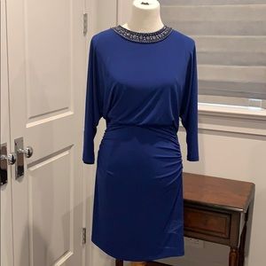 Blue party dress 3/4 length sleeves.
